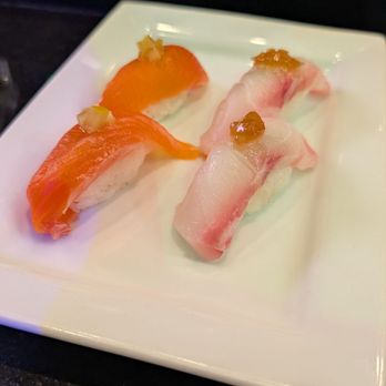 Takashi - Left - Fuji sake (salmon) nigiri, Right - Ishidai (barred knifejaw) nigiri - Sushi Bars Near Me - Salt Lake City, Utah