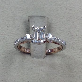 NJ Jewelers Inc - Engagement Ring, with a emerald cut 1 carat diamond, and a hint of rose gold. - Jewelry Near Me - McAllen, Texas NJ Jewelers Inc - Engagement Ring, with a emerald cut 1 carat diamond, and a hint of rose gold. - Jewelry Near Me - McAllen, Texas