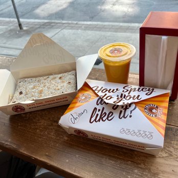 Butter Chicken Roti - a box of rice and a cup of orange juice - Indian Near Me - Toronto, Ontario Butter Chicken Roti - a box of rice and a cup of orange juice - Indian Near Me - Toronto, Ontario