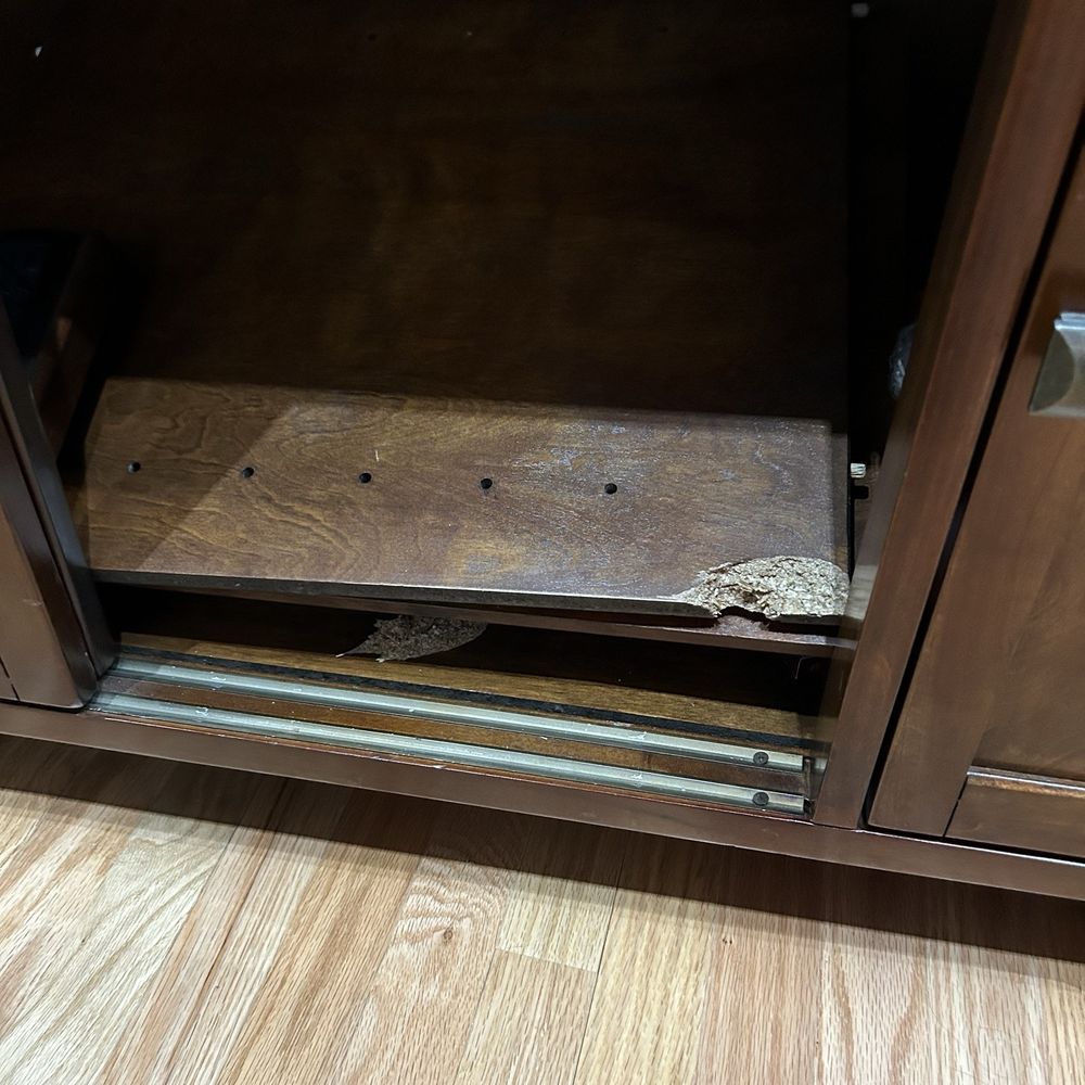 Cardinal Moving - Chunk out of the entertainment center shelf - Movers Near Me - Louisville, Kentucky