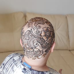 Henna crown - The henna is wet. This will dry and flake off leaving a orange-ish/brown color tint.
