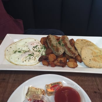 The Bridge - Two eggs over medium, house potatoes, chicken sausage and house biscuit - Sports Bars Near Me - Seattle, Washington