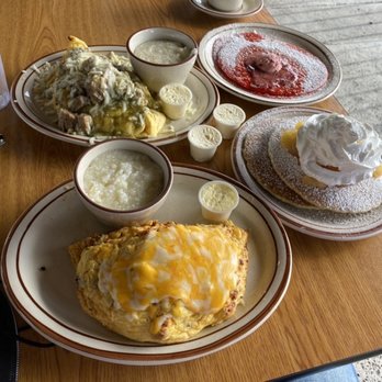 Evergreen Inn & Pub - Chile Verde Omelette with grits and Swedish Pancakes Chorizo Omelette with pancakes and apple topping - Pubs Near Me - San Jose, California