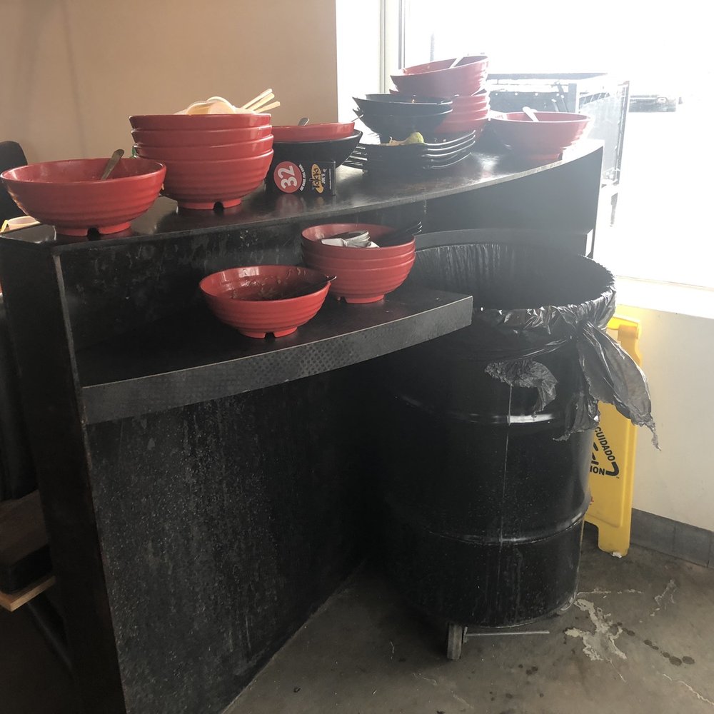 Stacks and stacks of dishes at each bin.