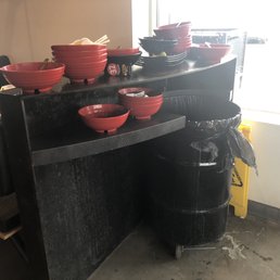 Stacks and stacks of dishes at each bin.