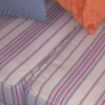 Palm Suites - dingy/ stained couch pullout couch - Hotels Near Me - Atlantic Beach, North Carolina