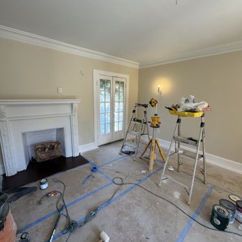 American Construction Era - "Interior painting project in progress: room preparation, wall and ceiling priming, professional setup for a flawless finish." - Furniture Assembly Near Me American Construction Era - "Interior painting project in progress: room preparation, wall and ceiling priming, professional setup for a flawless finish." - Furniture Assembly Near Me