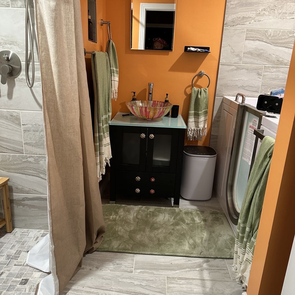 Triton Contracting Services - a bathroom with orange walls - General Contractors Near Me - Virginia Beach, Virginia Triton Contracting Services - a bathroom with orange walls - General Contractors Near Me - Virginia Beach, Virginia
