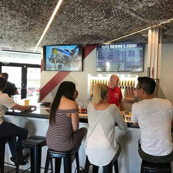 Elite Brewing & Cidery - customers at the bar - Cideries Near Me - Calgary, Alberta Elite Brewing & Cidery - customers at the bar - Cideries Near Me - Calgary, Alberta