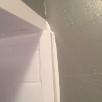 Bath Fitter - Sloppy corner. Uneven and just caulked over to make it "look nicer". Shocked that this is what is acceptable by their standards. - General Contractors Near Me - Arlington, Texas