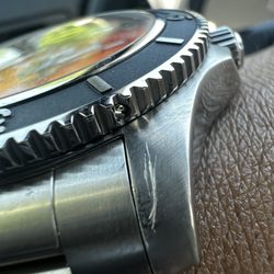 Center Gold Jewelers - deep scratch on watch, before taking it to Center Gold.
