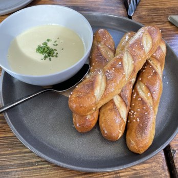 Benchmark - The artichoke fondue with Bavarian pretzel breadsticks - New American Near Me - Santa Ana, California