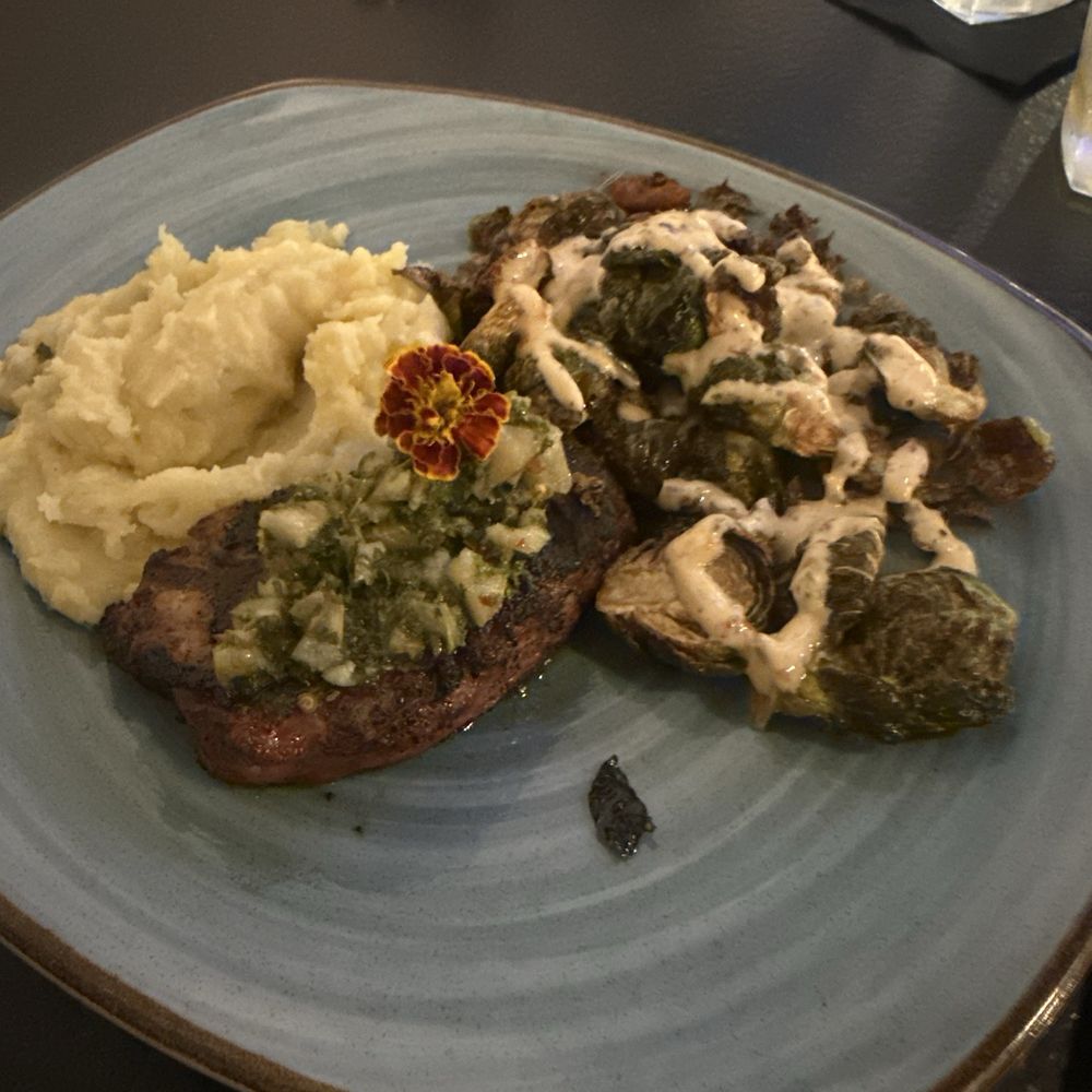 Pork chop with mashed potatoes and brussel sprouts