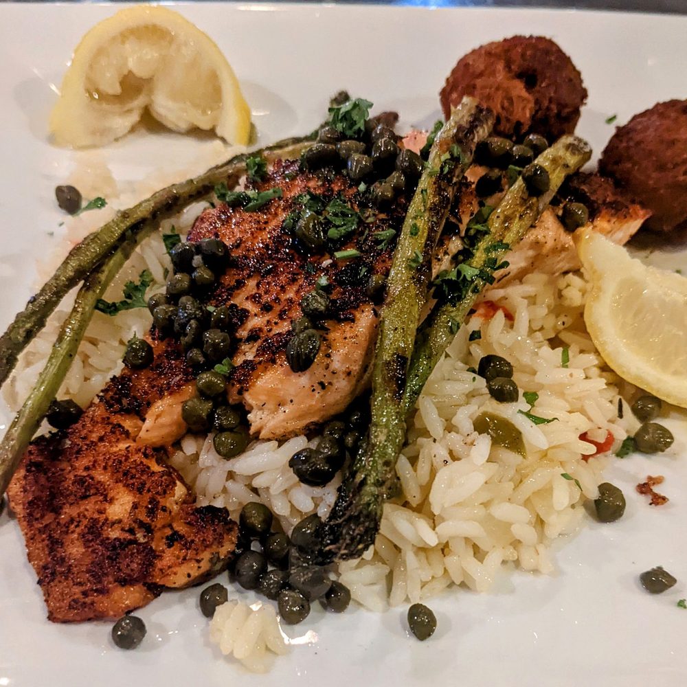 The Fish Market Restaurant - Salmon with lemon asparagus , capers& Greek rice with hush puppies - Seafood Near Me - Hoover, Alabama The Fish Market Restaurant - Salmon with lemon asparagus , capers& Greek rice with hush puppies - Seafood Near Me - Hoover, Alabama