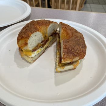 4 Brothers NY Bagels - Bacon, egg and cheddar cheese bagel sandwich on cheddar cheese bagel. - Bagels Near Me - Houston, Texas