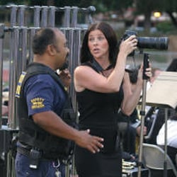 Gomes Images - Cathy Gomes using her Madera Tribune credential to take photos of her nephews graduation. Security asking her to leave the area.