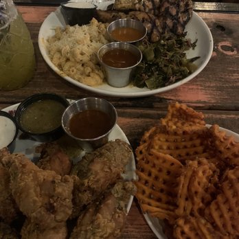 Lost & Found - 8 pc wings with honey lemon pepper & jerk sauce w/sweet potato fries and Grilled Chicken Thigh combo - Cocktail Bars Near Me - Houston, Texas Lost & Found - 8 pc wings with honey lemon pepper & jerk sauce w/sweet potato fries and Grilled Chicken Thigh combo - Cocktail Bars Near Me - Houston, Texas