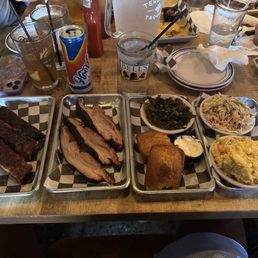 Ribs, pork belly, cornbread, coleslaw, potato salad, collard greens. Ribs, pork belly, cornbread, coleslaw, potato salad, collard greens.