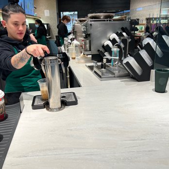Starbucks - a bari serving a cup of coffee - Coffee & Tea Near Me - Euless, Texas