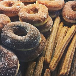a variety of donuts and churros a variety of donuts and churros