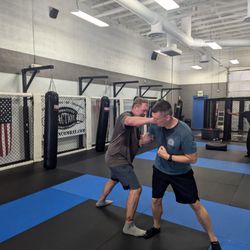 Faction Combatives - Class practicing weapon defense in our Self-Defense classes near Gilbert