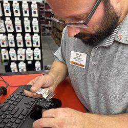 Auto Zone - Arron demonstrating how to repair my mirror. Great guy!