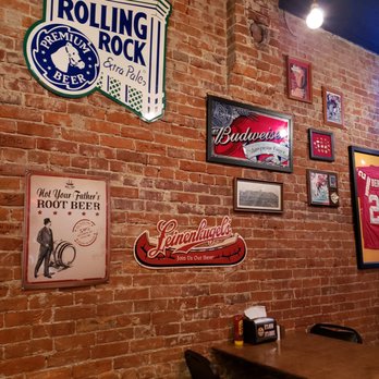 Pigskin Pub & Pizza - a brick wall with various signs - Pubs Near Me - Brookfield, Missouri Pigskin Pub & Pizza - a brick wall with various signs - Pubs Near Me - Brookfield, Missouri