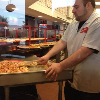 Famous Joe's - a man preparing a pizza - Pizza Near Me - Carrollton, Texas Famous Joe's - a man preparing a pizza - Pizza Near Me - Carrollton, Texas