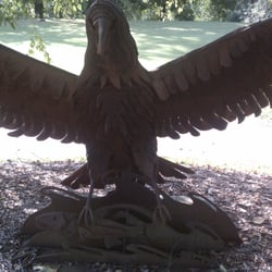 Eagle Bluff Golf Club - A metal sculpture of an eagle at the 1st tee. Take time to notice some of the intricate detail - the fish in the water.