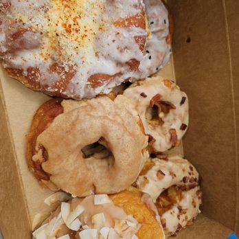 Elote fritter, ube black sesame, maple bacon, coconut guava & whiskey peach