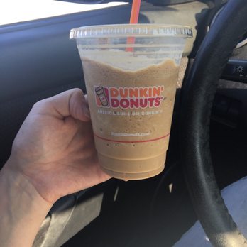 Dunkin' - a hand holding a cup of coffee - Donuts Near Me - Naugatuck, Connecticut Dunkin' - a hand holding a cup of coffee - Donuts Near Me - Naugatuck, Connecticut