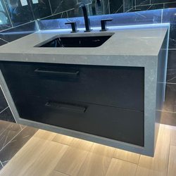 Stone&Beyond - Flatting cabinet with quartz warp around.