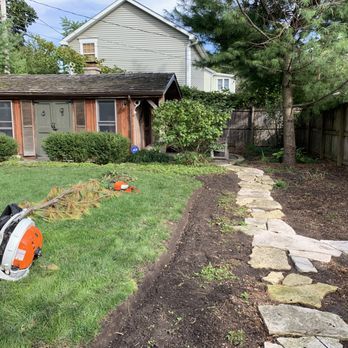 Conga Landscaping - a yard with a lawn mower - Landscaping Near Me Conga Landscaping - a yard with a lawn mower - Landscaping Near Me