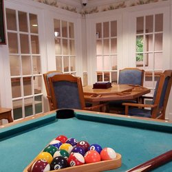 Savannah Grand of Maitland - Game room with pool table and card table