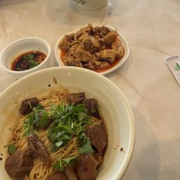 Top to bottom: minced pork dry noodles, chili chicken (cold dish), and chili beef dry noodles Top to bottom: minced pork dry noodles, chili chicken (cold dish), and chili beef dry noodles