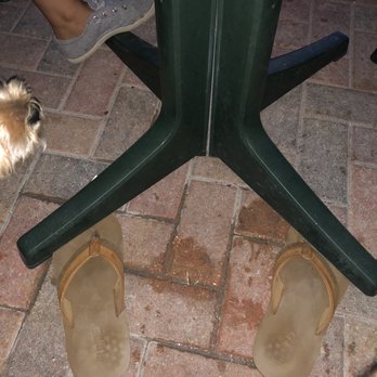 Sunset Grille & Raw Bar - Using my sandals to keep table leveled - Seafood Near Me - Marathon, Florida Sunset Grille & Raw Bar - Using my sandals to keep table leveled - Seafood Near Me - Marathon, Florida