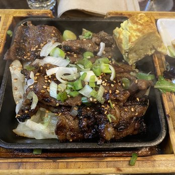 Del Seoul - Beef Kalbi bento box with onion and egg omelette slices. - Korean Near Me - Chicago, Illinois
