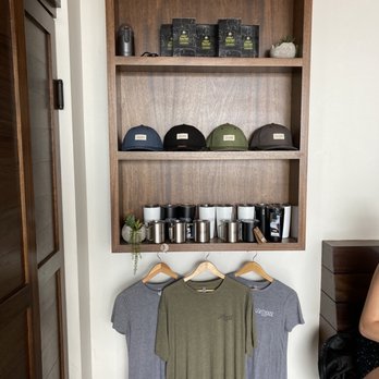 Lighthouse Coffee - a shelf of coffee and t - shirts - Coffee & Tea Near Me - Santa Barbara, California Lighthouse Coffee - a shelf of coffee and t - shirts - Coffee & Tea Near Me - Santa Barbara, California