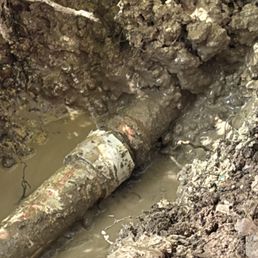 Water leak where PVC joins copper. You can see the water squirting up even after water has been turned off & pipes drained. Water leak where PVC joins copper. You can see the water squirting up even after water has been turned off & pipes drained.