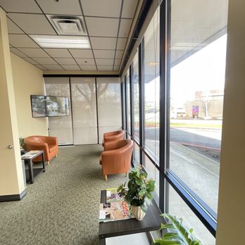 Denti Belli Dentistry - Lobby seating area with tv and magazines and plants - Cosmetic Dentists Near Me - Renton, Washington Denti Belli Dentistry - Lobby seating area with tv and magazines and plants - Cosmetic Dentists Near Me - Renton, Washington