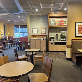 Panera Bread - Piled up dishes and yet people on their phones behind the food counter. - Salad Near Me - Miamisburg, Ohio