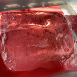 Clear Large block of ice, the ice goes through a process which pushes out a lot of  impurities in ice resulting in the clear appearance.