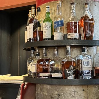 Forge Pizza - bottles of liquor lined up on shelves - Pizza Near Me - Oakland, California