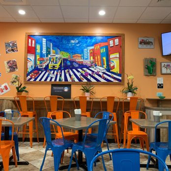 Chios Rotisserie - Cute colorful indoor seating - Peruvian Near Me - Garner, North Carolina Chios Rotisserie - Cute colorful indoor seating - Peruvian Near Me - Garner, North Carolina