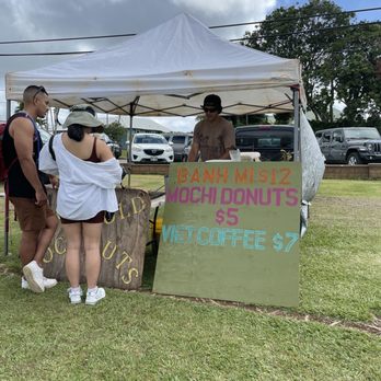 Grove Farm Market - a woman selling doughnuts - Farmers Market Near Me - Lihue, Hawaii