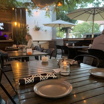 Benchmark - Romantic patio seating - New American Near Me - Santa Ana, California