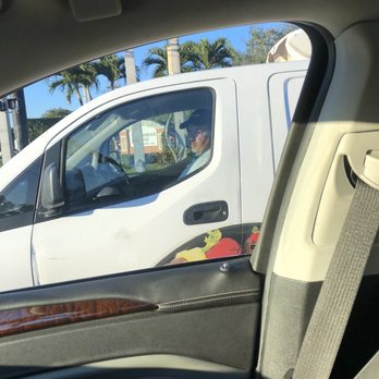 Edible Arrangements - a white van parked in a parking lot - Gift Shops Near Me - Hollywood, Florida