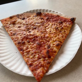 Stella's Pizza - a slice of pizza on a paper plate - Pizza Near Me - Watertown, Massachusetts Stella's Pizza - a slice of pizza on a paper plate - Pizza Near Me - Watertown, Massachusetts