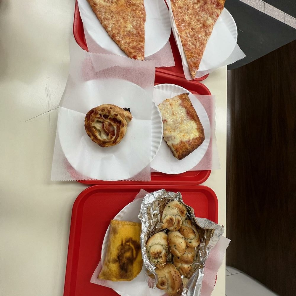 Pizza, scilain pizza, pepperoni roll, gralic knots, and beef patty Pizza, scilain pizza, pepperoni roll, gralic knots, and beef patty