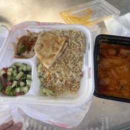 Chicken curry with rice, hummus and a small salad